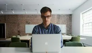 teacher working on a mac