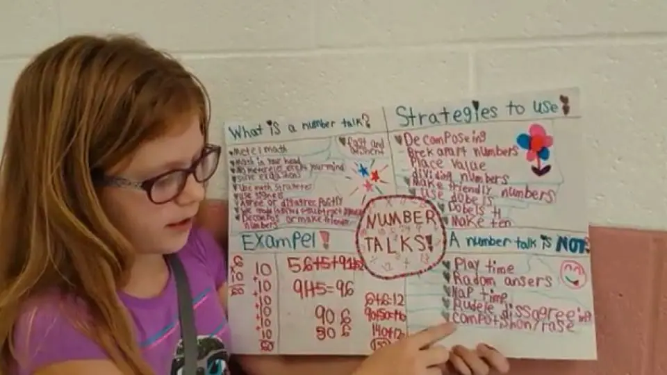 a student using math anchor chart