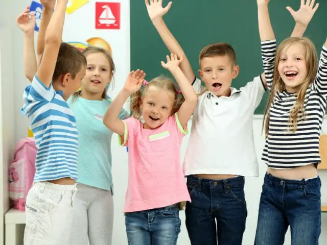 portrait of happy students in classroom