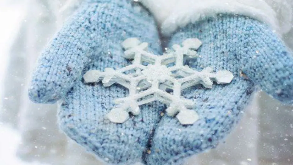 snowflake in hand with glove