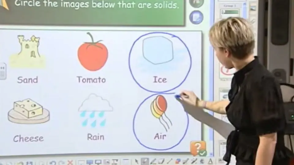 teacher showing how smartboard works