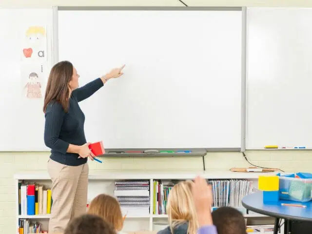 teacher using smart board in class