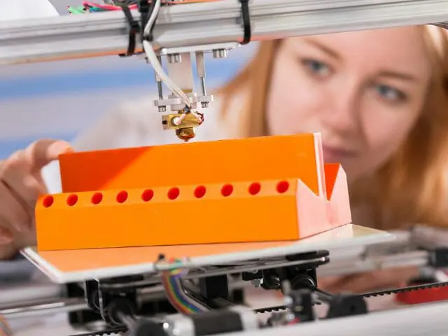 woman looking at 3d printer cad model