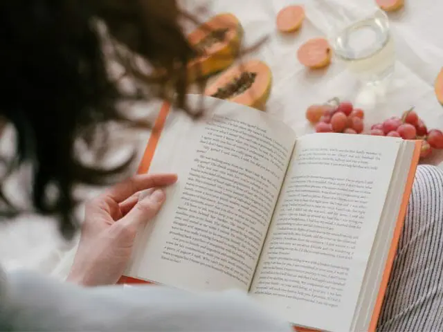 woman reading passages on book