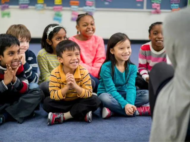1st graders smiling in a class
