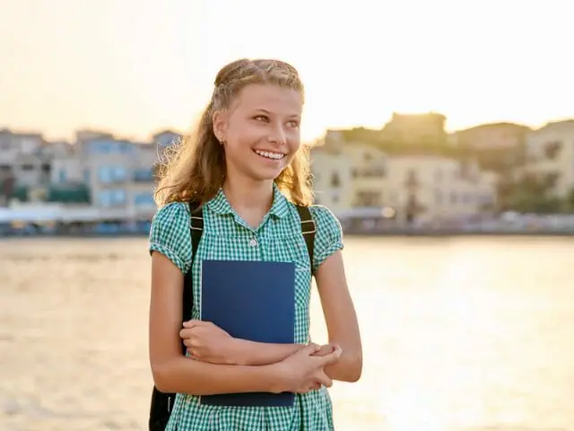 5th grader student with river background