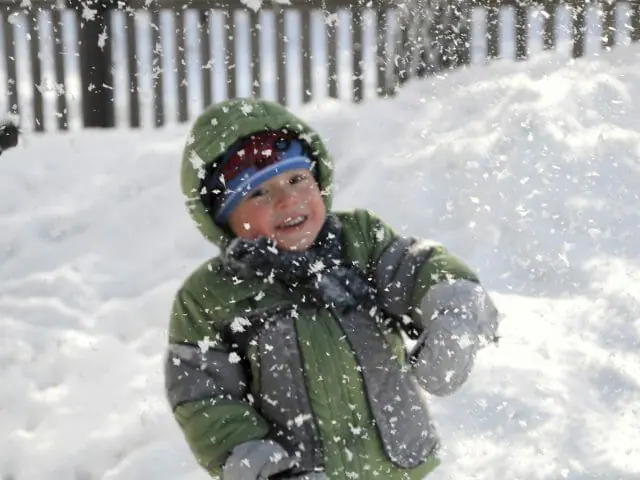 boy with falling snow image