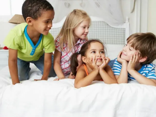 children playing on bed
