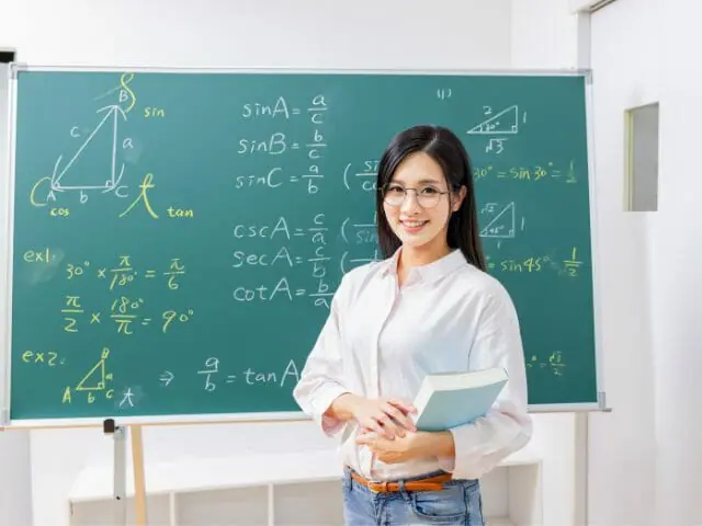 female teach in geometry class