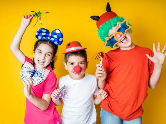group of children wearing photo booth props