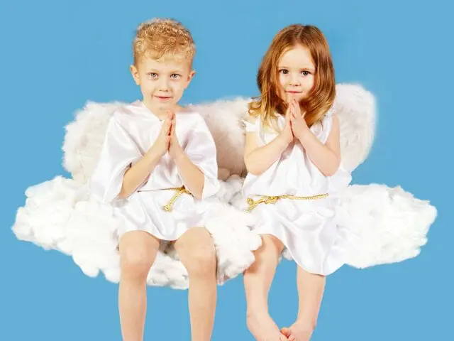 little boy and girl in angel costumes