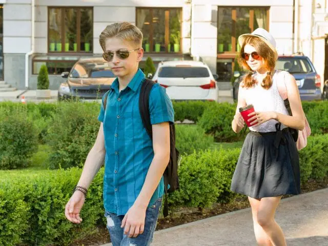 middle schoolers walking on school campus