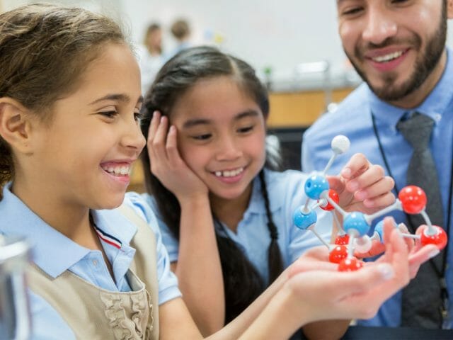 teacher teaching students with shape subject