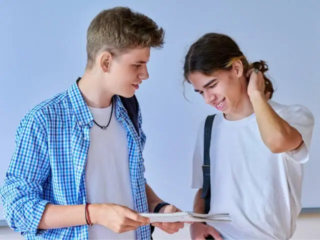 two students talking and laughing