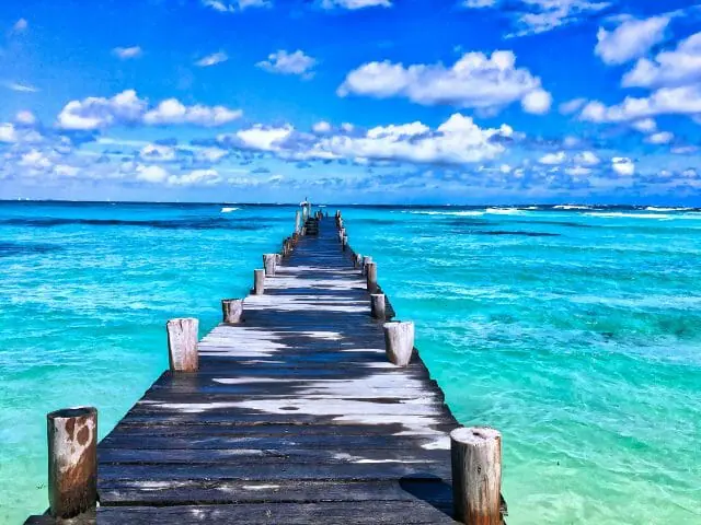 wooden dock across the ocean