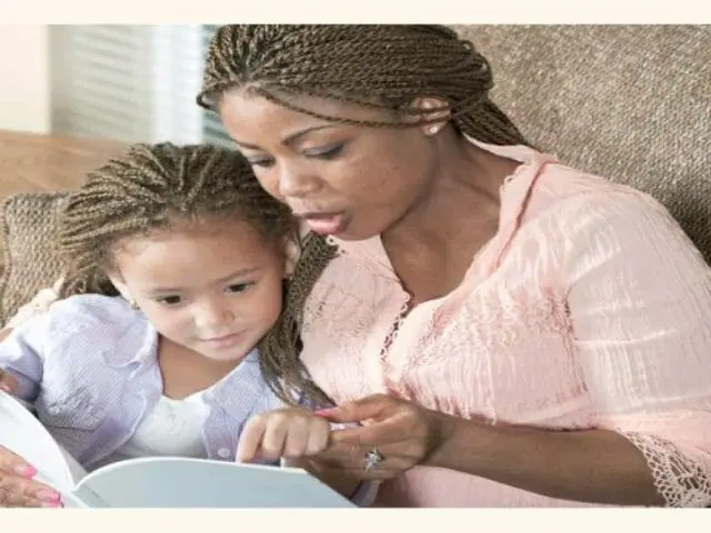 parent teaching her child at home